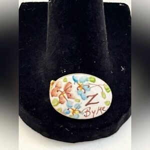 hand-painted porcelain floral brooch by the brand "Z ByMe